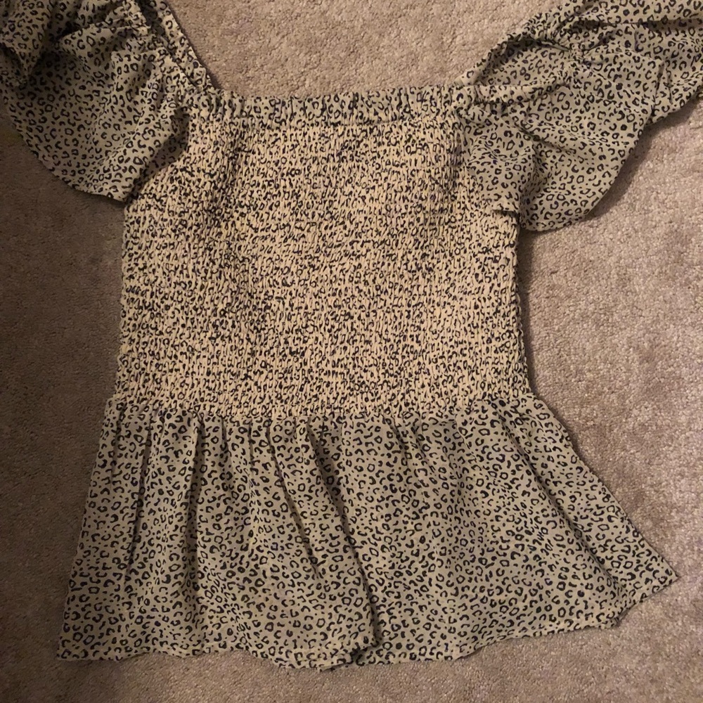 This cute ruffle top is a size XS